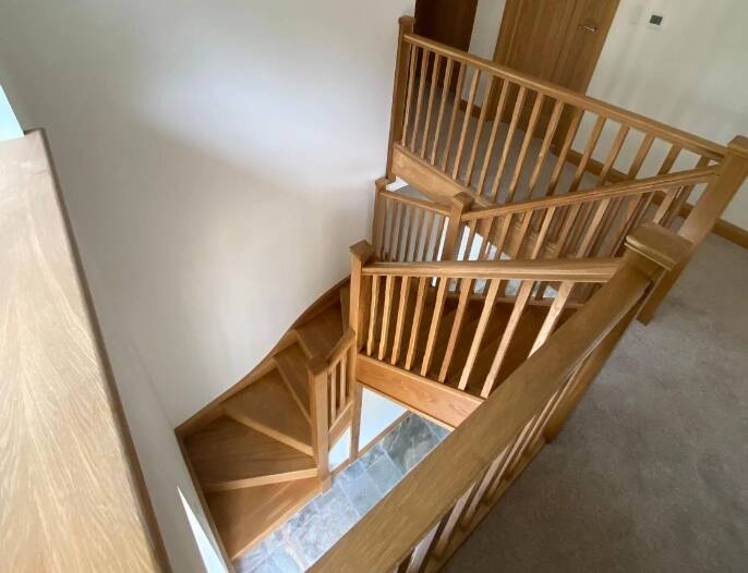 Bespoke carpentry for a custom wooden staircase in Southampton extension